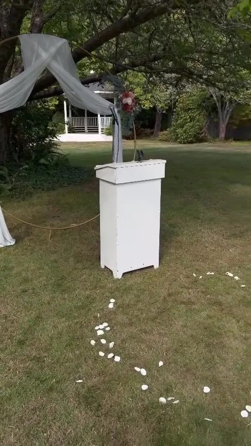 Garden ceremony arch and aisle setup
