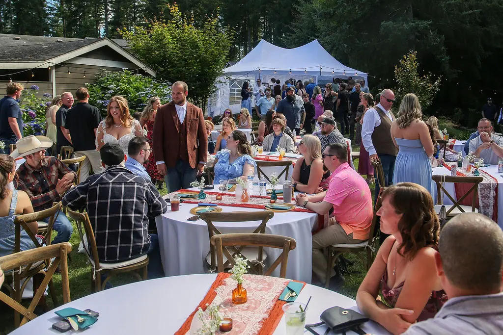Outdoor reception with the newlyweds and their guests